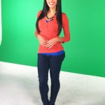 Desi Sanchez standing in front of a green screen